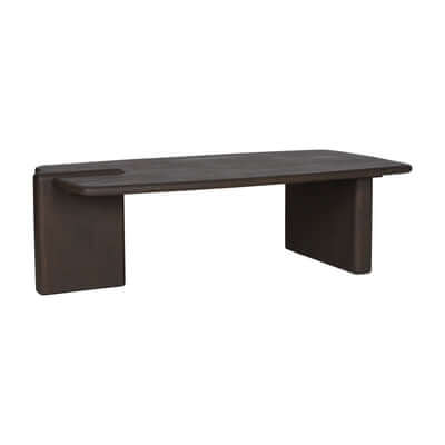A modern dark brown wooden bench with a thick rectangular seat, block-style legs, and a circular cutout on the left side, shown against a plain white background.