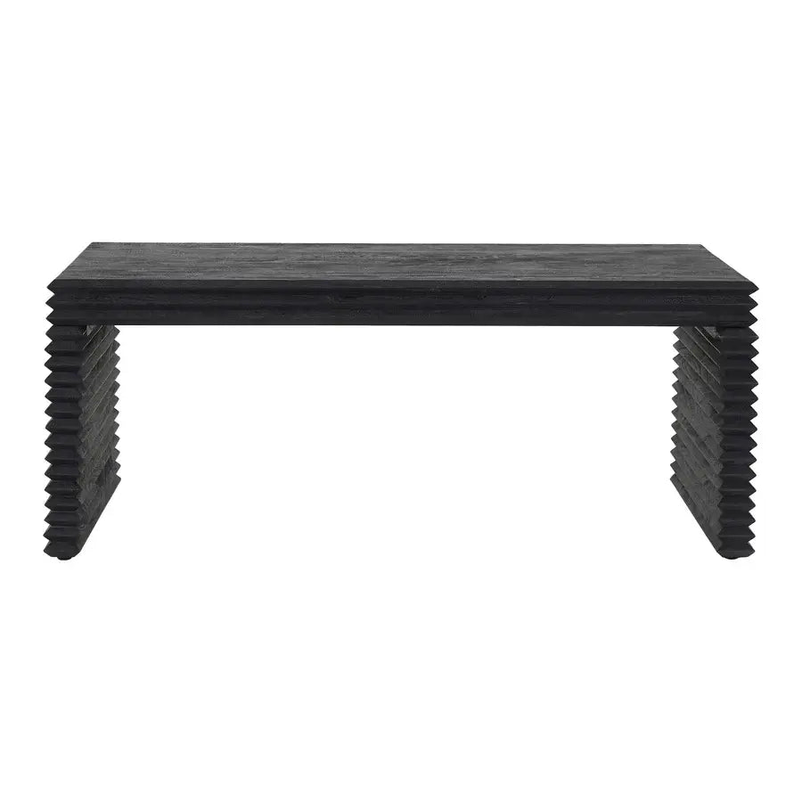 A black rectangular console table with a thick textured top and stacked, zigzag-style legs, shown against a plain white background.