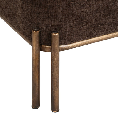 Close-up of the corner of an upholstered furniture piece in dark brown textured fabric with a bronze metal frame and two cylindrical legs on a white background.